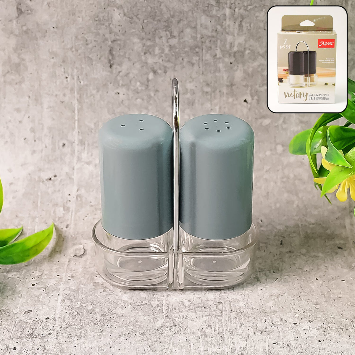 Salt & pepper shakers made of clear acrylic on dining table for precise seasoning Main image