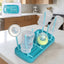 Baby feeding bottle drying rack with hygienic removable drip tray on countertop