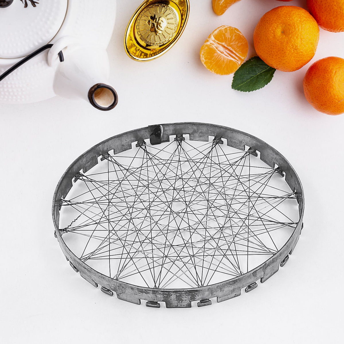 Indo Glow Chota Tandoor Grill jalli placed on a gas stove burner, ready for use. Main image