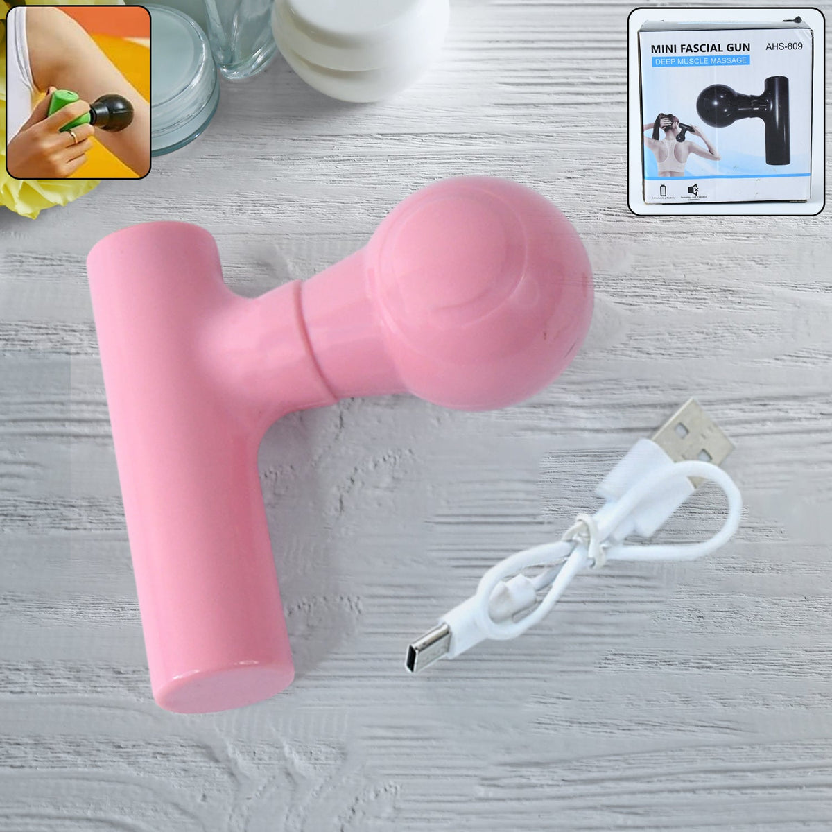 Compact black cordless body massager for pain relief, front view. Main image