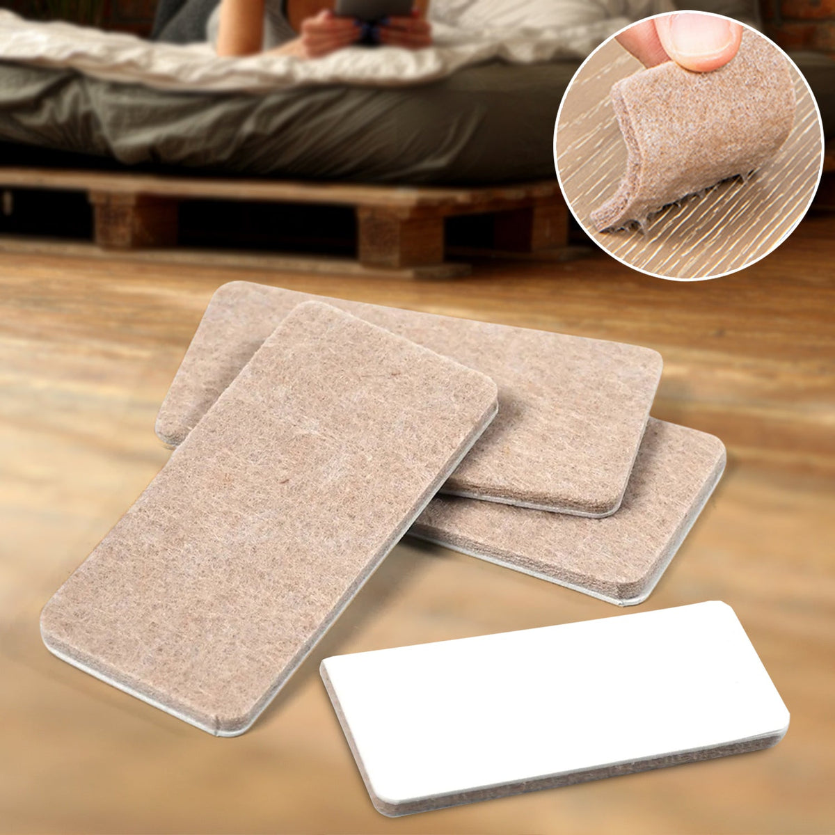 Close-up of Safelix square felt furniture pads on a wooden floor, protecting against scratches. Main image