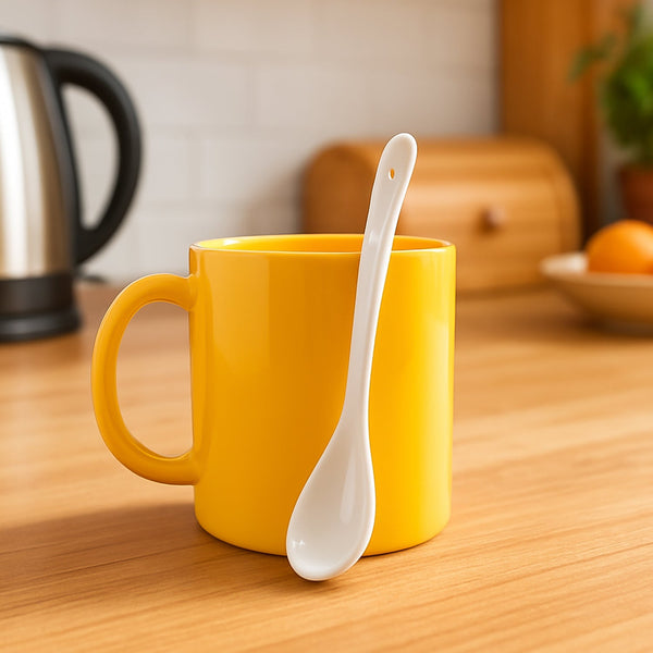 Plastic mug with a glossy finish and matching spoon for tea and coffee