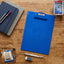 Blue plastic clipboard with secure metal clip for documents