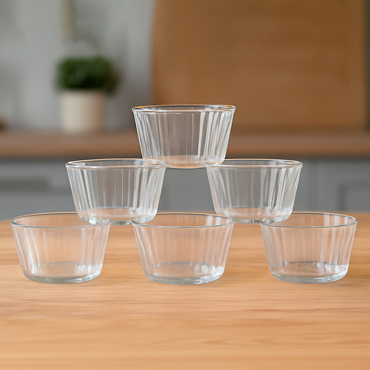 Set of 6 transparent plastic dessert bowls with elegant fluted design Main image