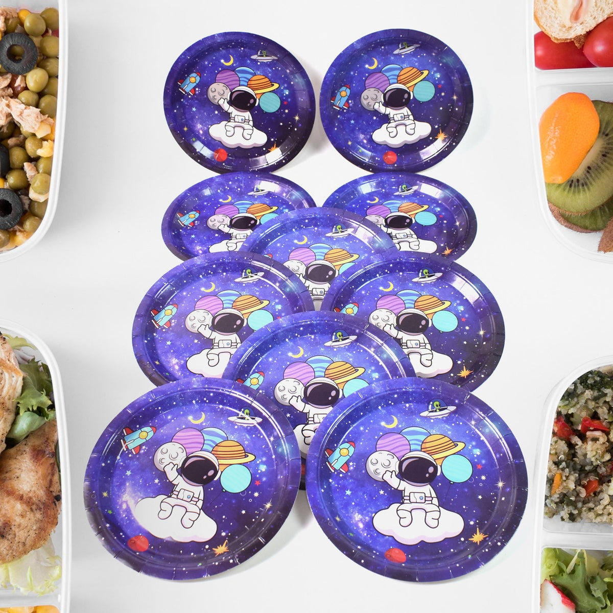 Stack of vibrant disposable paper plates with birthday party designs. Main image