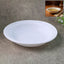 Deep round white curry bowl with glossy finish on white background