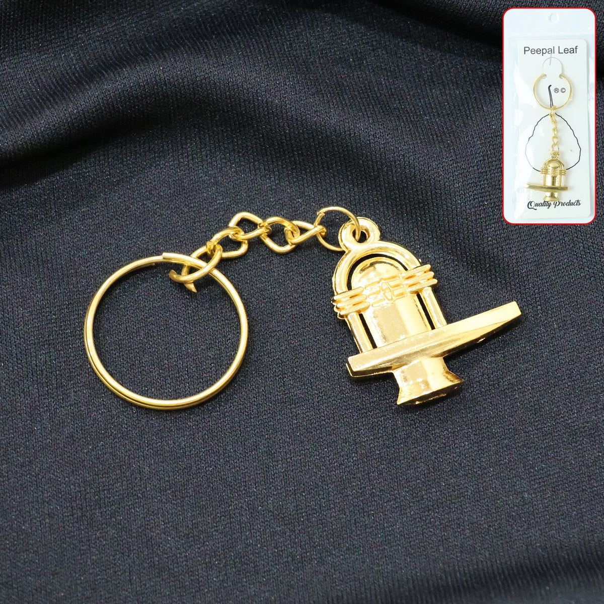 Golden Shivling metal keychain displayed on white background symbolizing spiritual devotion Main image