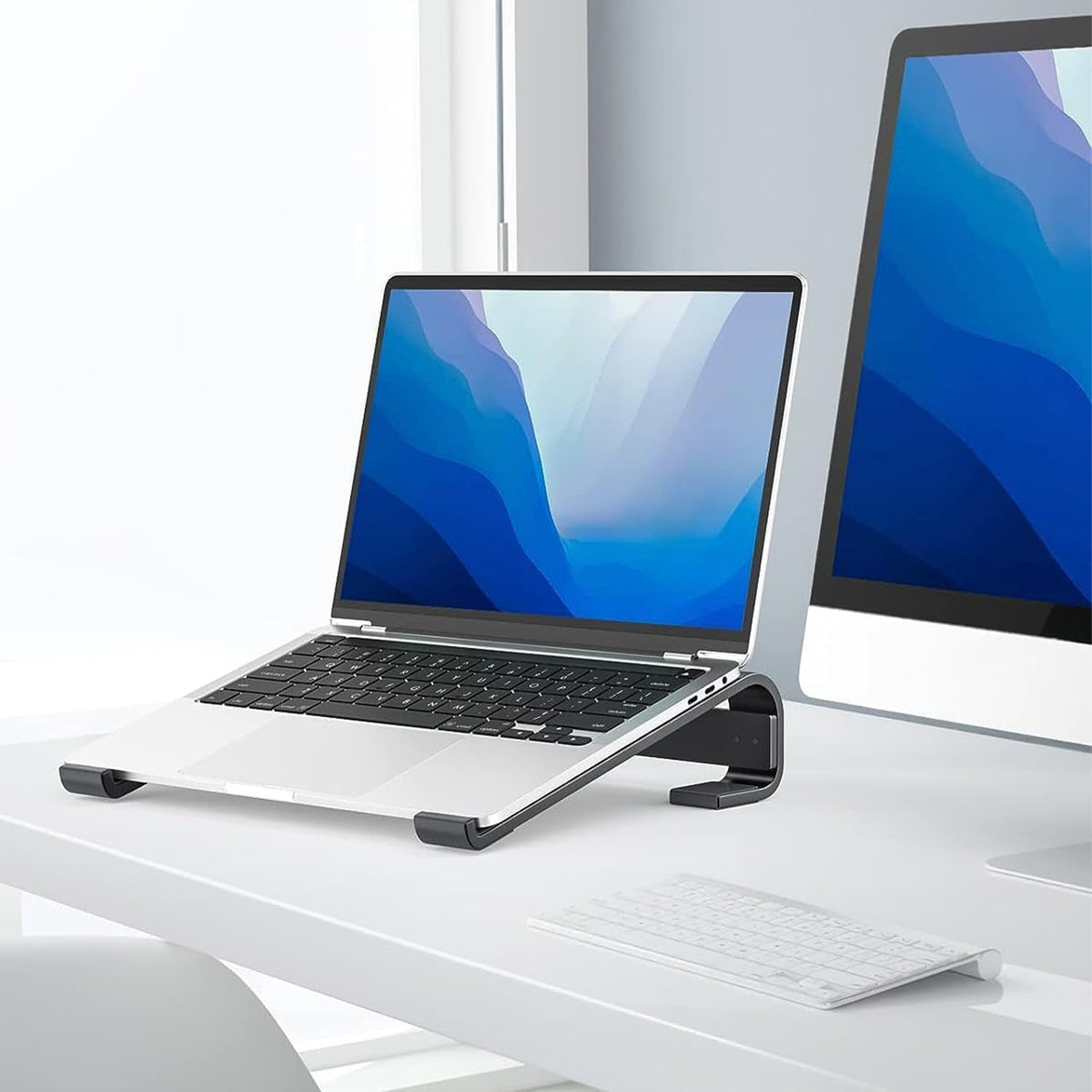 Fixed metal laptop stand offering ergonomic desk support Main image