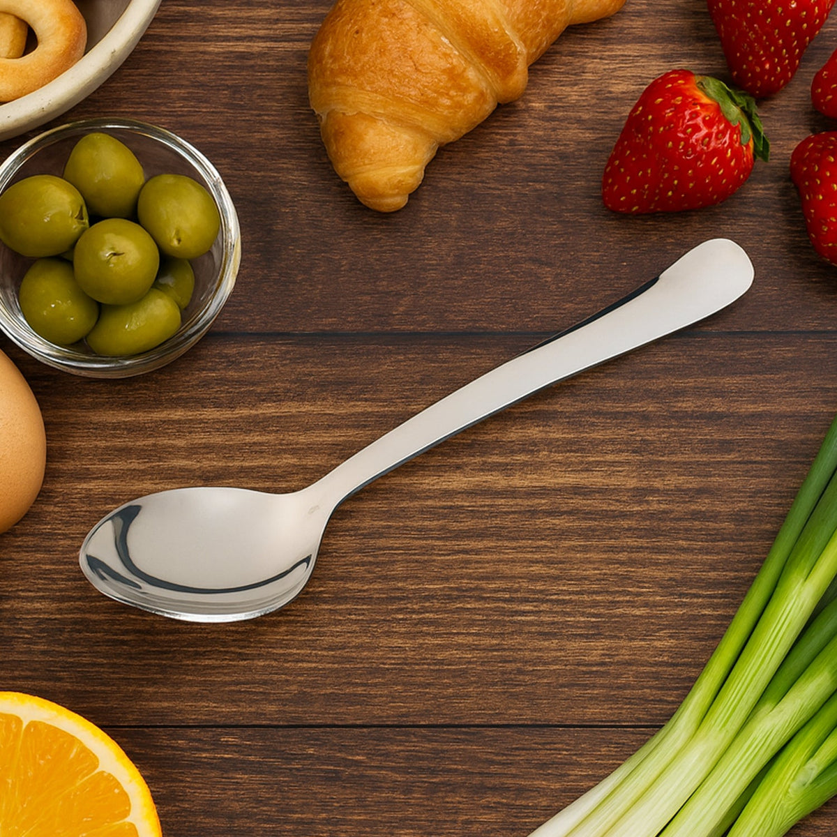 Close-up of a single Stainless Steel Dining Spoon with a bright mirror finish. Main image
