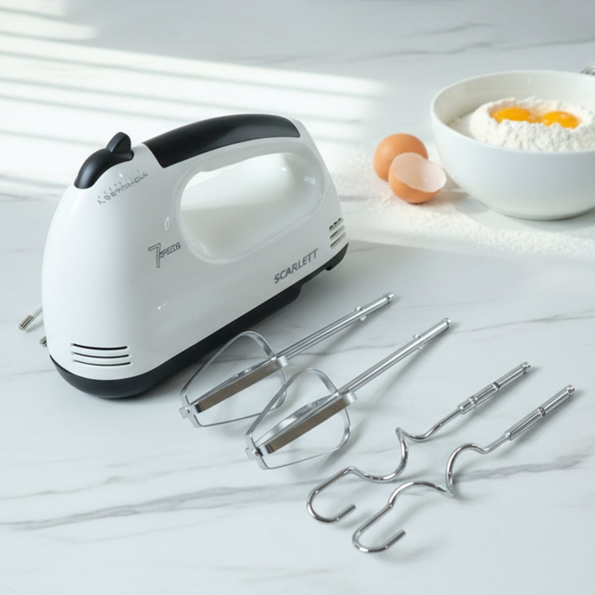 Electric hand mixer set with stainless steel beaters and dough hooks on countertop Main image