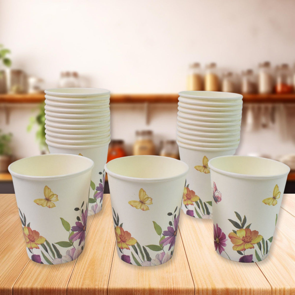 Disposable paper cups in mixed colours and designs, ready for use. Main image