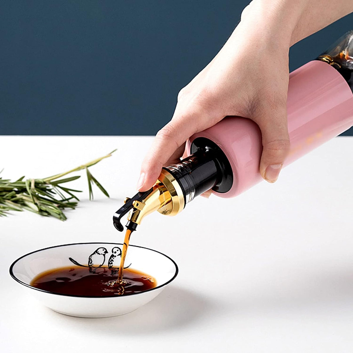 Vastate 300ml olive oil dispenser with a non-drip spout, shown against a clean kitchen background. Main image