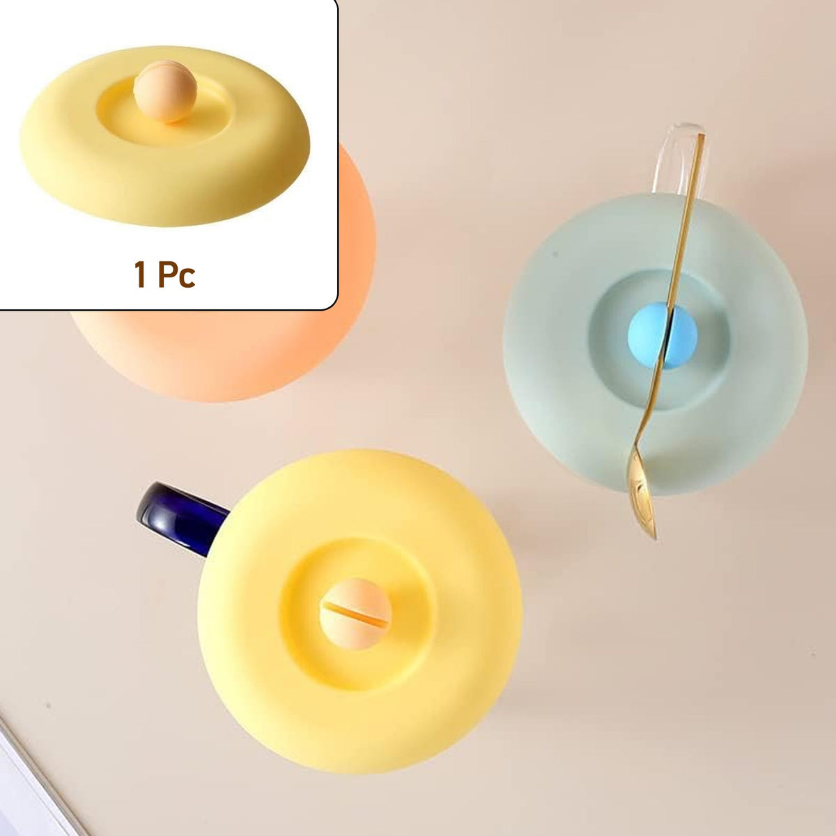 A Tidy Table Silicone Cup Lid in grey, providing an airtight, dust-proof seal on a ceramic mug. Main image