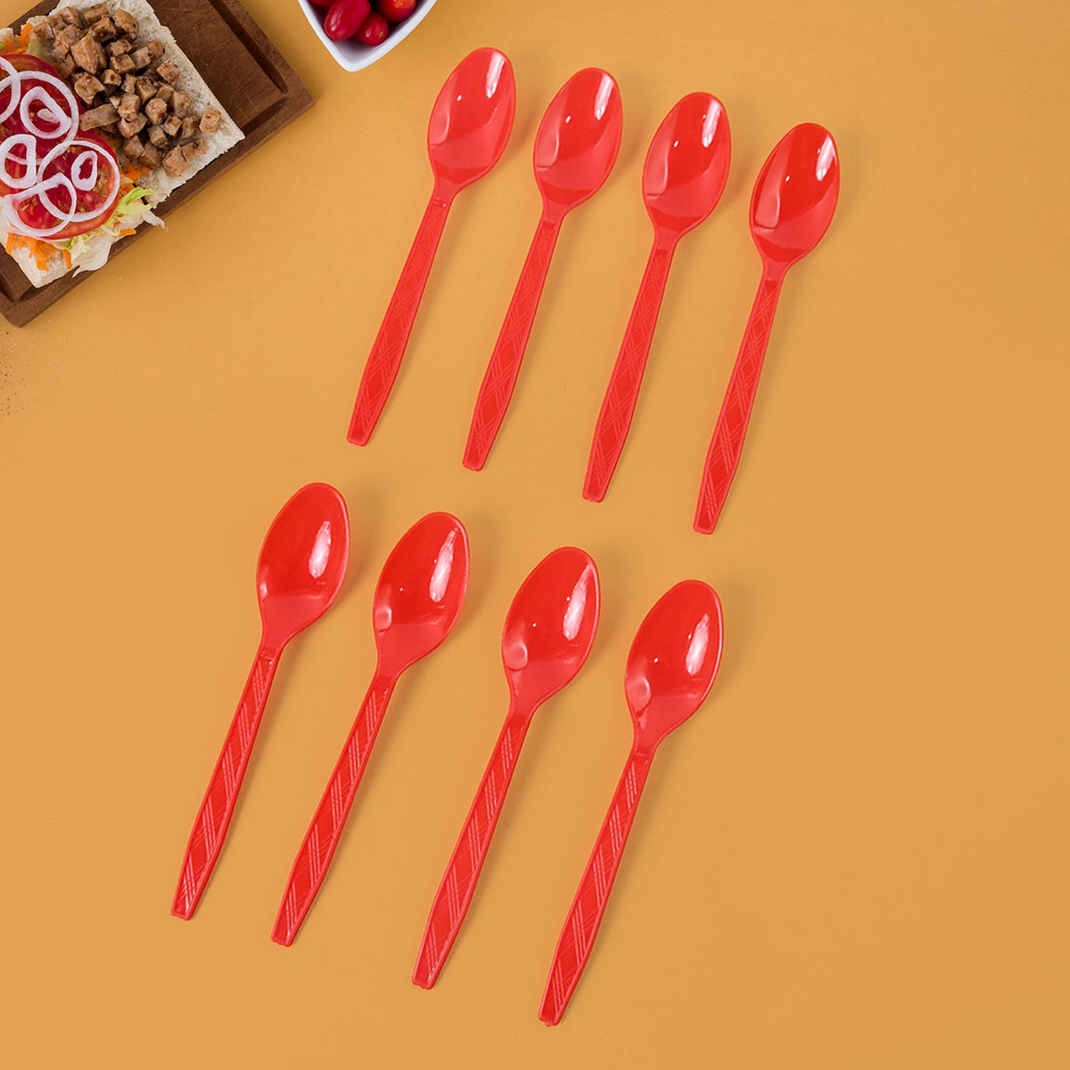 Set of 8 reusable plastic spoons arranged neatly in vibrant colors for home and outdoor use Main image