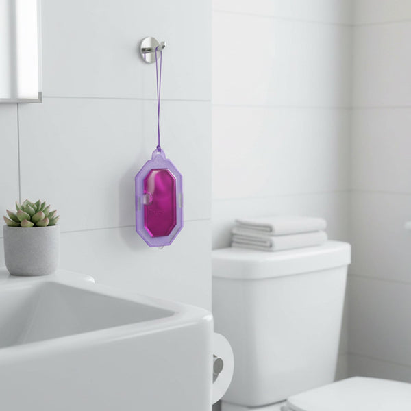 Compact lavender scent toilet freshener hanging in bathroom