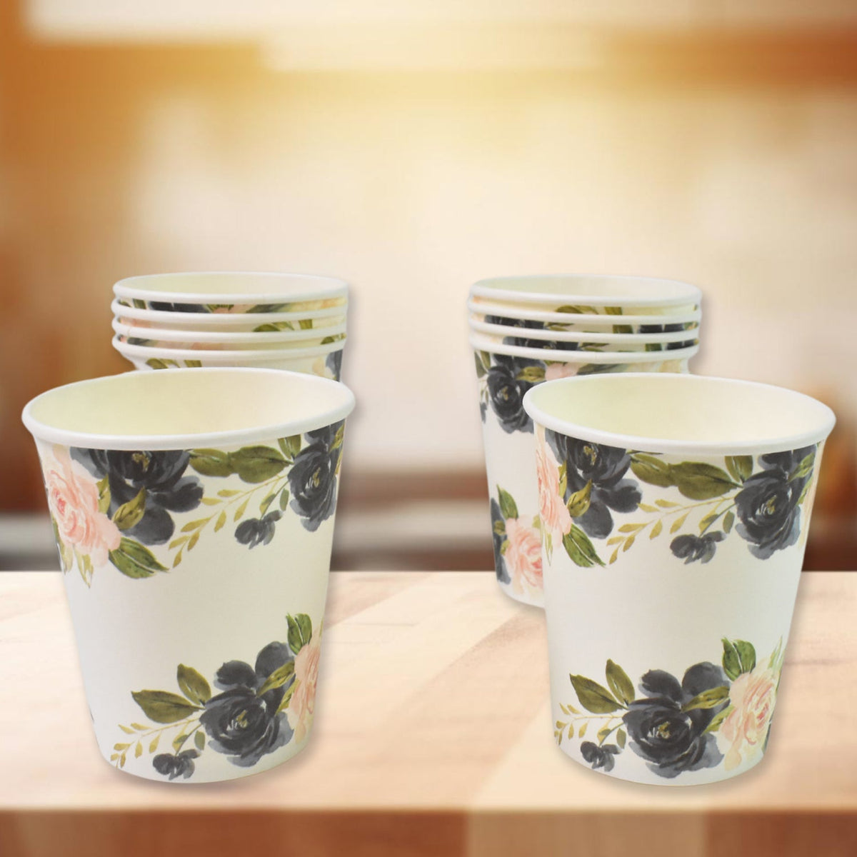 Assorted disposable paper cups in mixed colors and designs for beverages. Main image