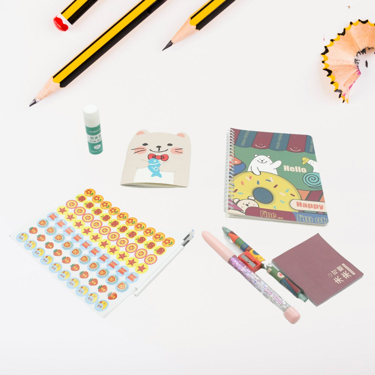 Vibrant cartoon stationery box with a notebook, pen, and eraser for school kids. Main image
