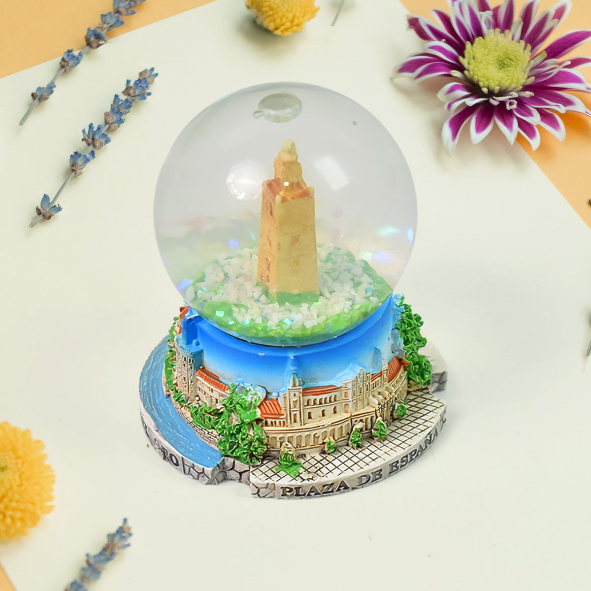 A beautifully crafted decorative snow globe featuring a festive scene, perfect for desk decor. Main image
