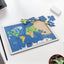 Completed wooden world map puzzle showing continents, animals, and landmarks.