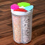 Transparent 4 section storage container with a pink lid, holding various cereals.