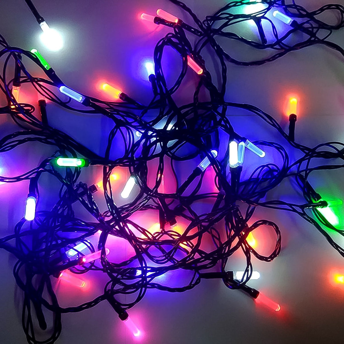 Multi-color Diwali LED string light illuminating a festive home setting. Main image