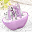 Compact apple-shaped manicure set with 8 stainless steel tools.