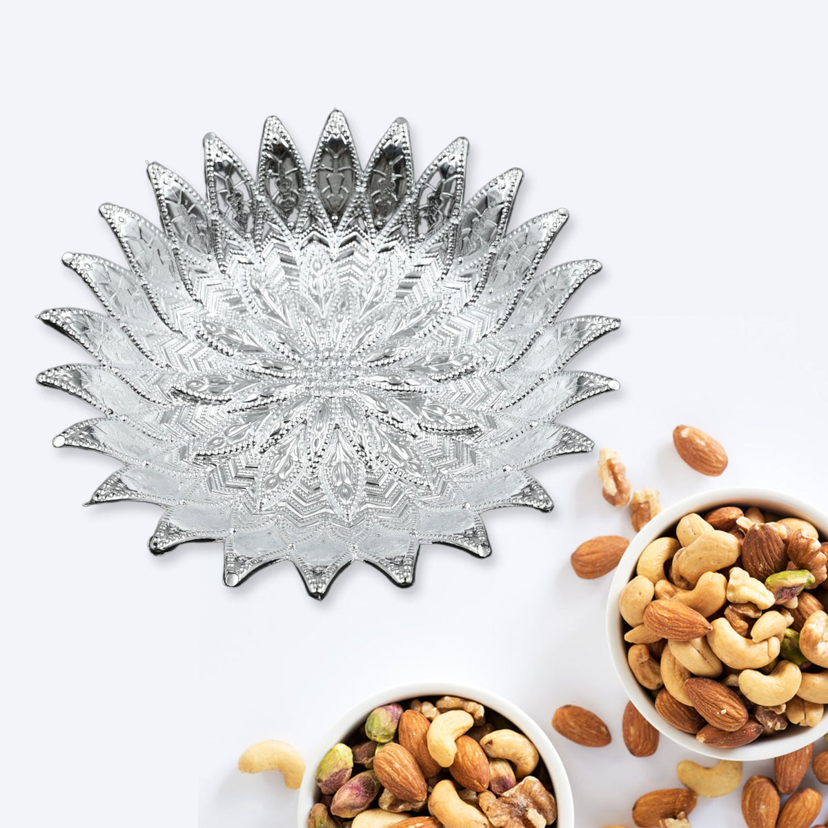 Decorative silver finish serving tray displaying mukhwas, perfect for Indian homes. Main image