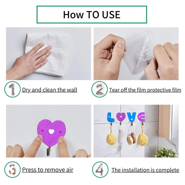 Set of three love shape self adhesive hooks on a clean white wall.
