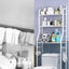 Multi-layer over toilet storage rack in a modern bathroom, showcasing its space-saving design.