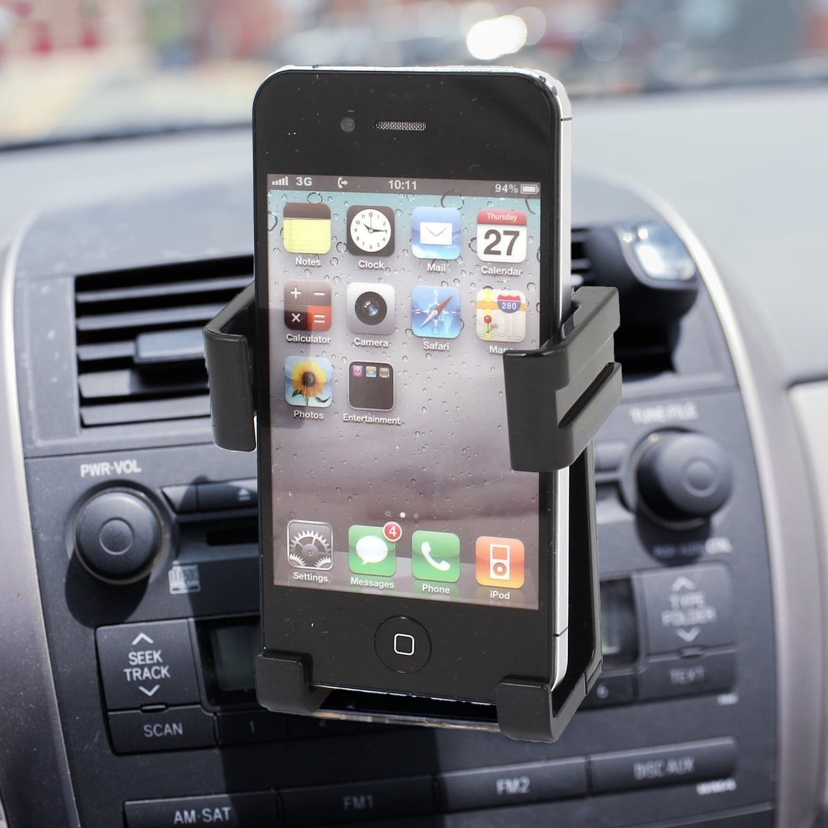 Car mobile holder securely mounted on a dashboard, displaying a smartphone for navigation. Main image