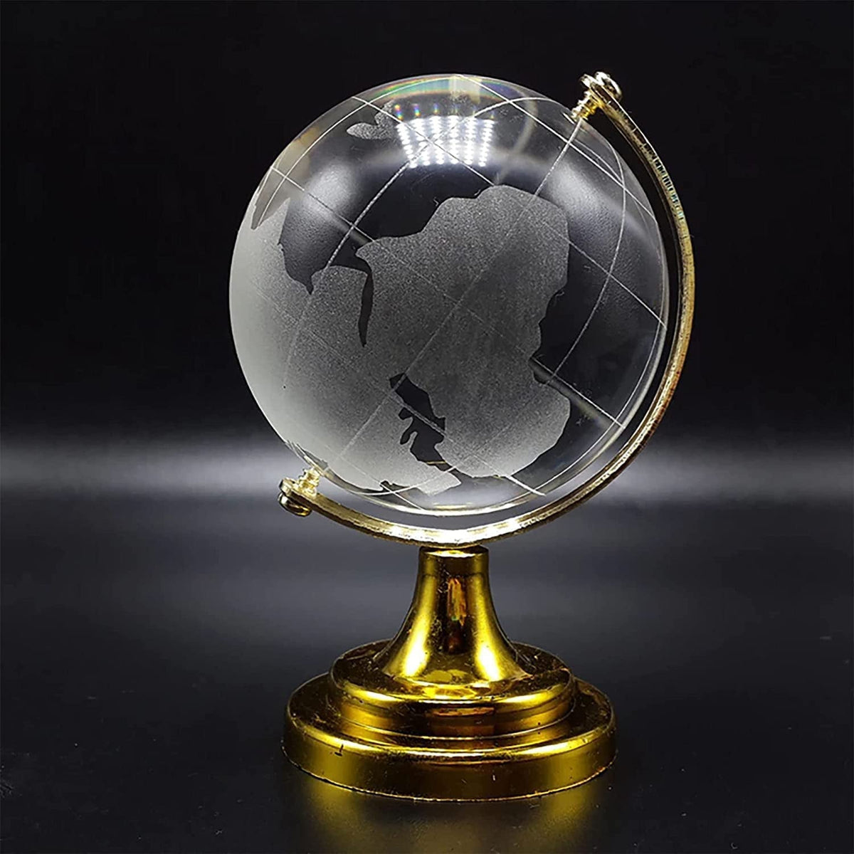 Crystal World Globe (50mm) with golden stand on a wooden surface. Main image