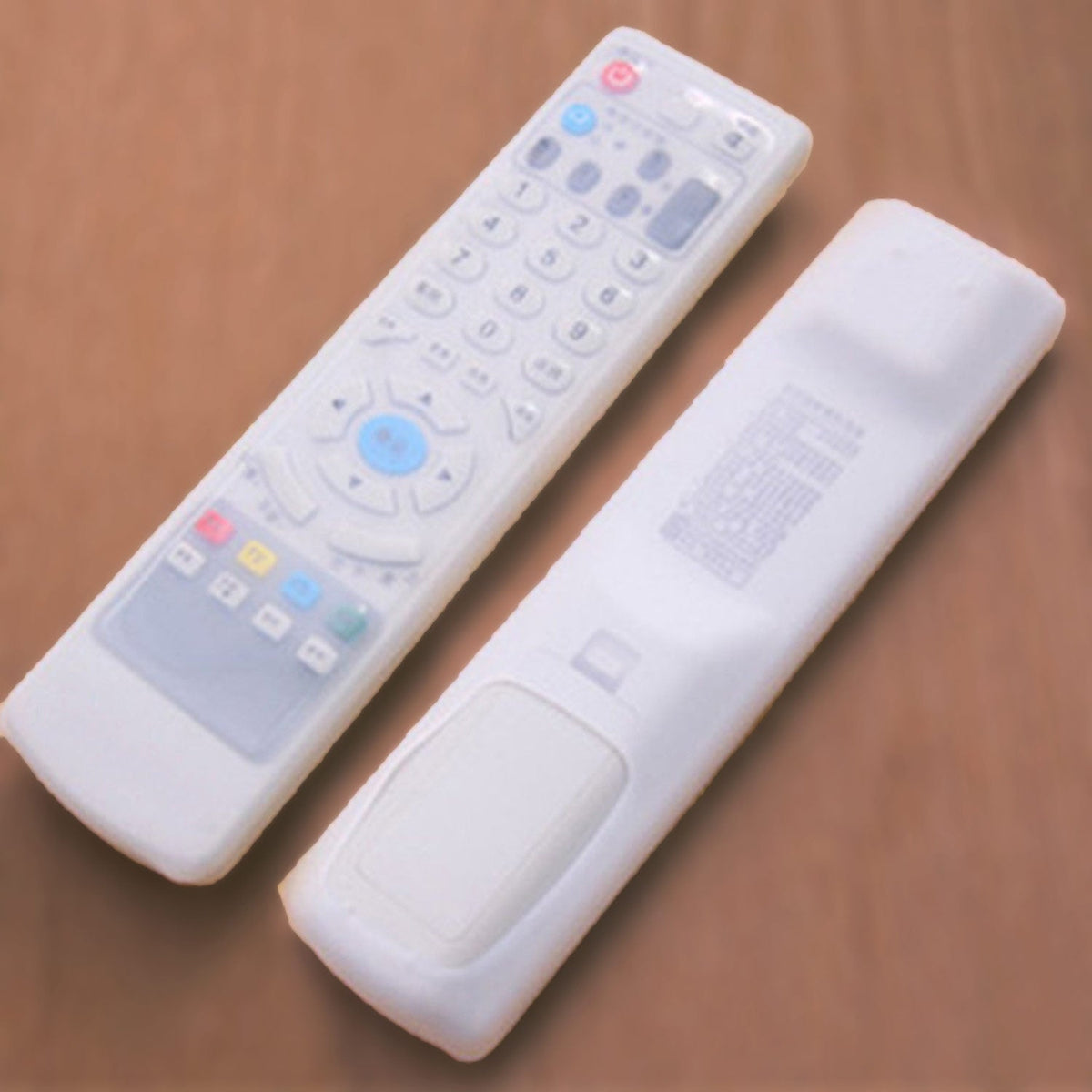 Clear DISH TV remote cover securely fitted over a set-top box remote control. Main image