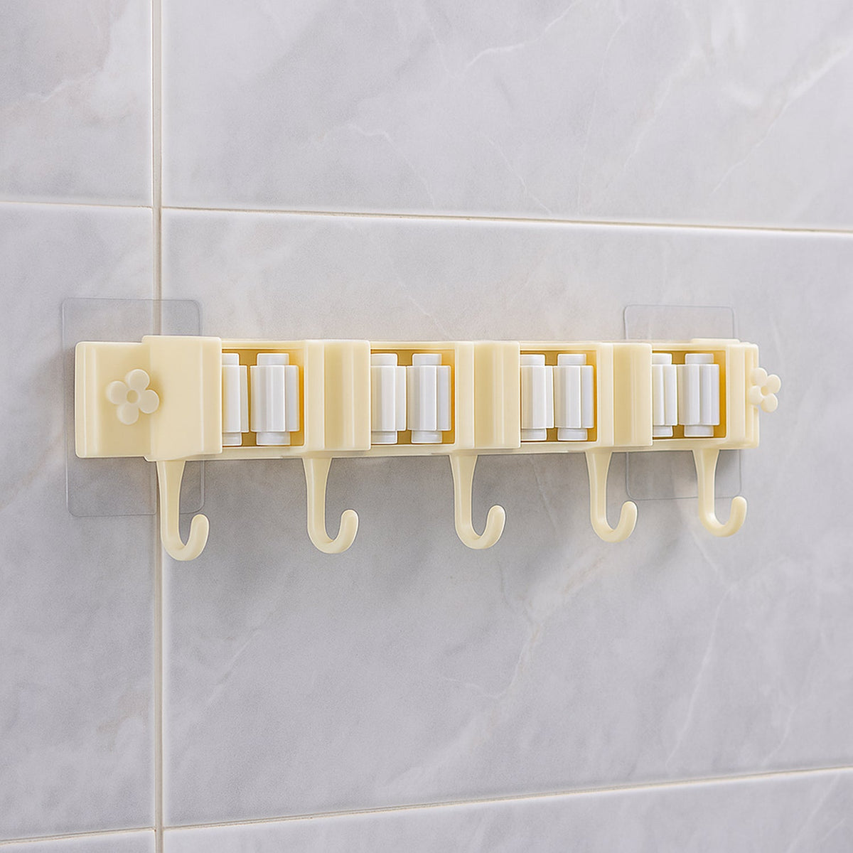 Self-adhesive broom and mop holder rack mounted on wall with utility hooks Main image