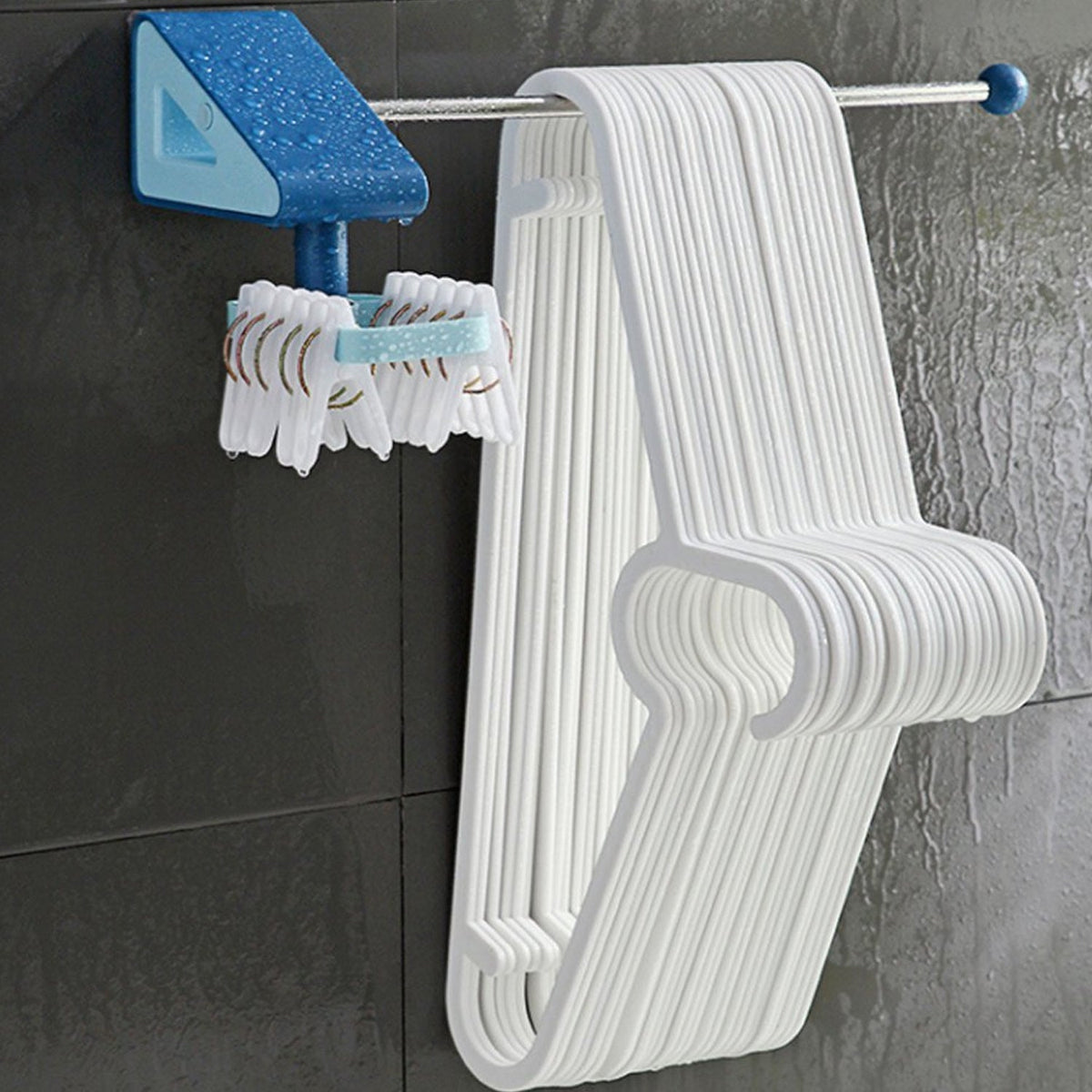 Self-adhesive utensil hooks neatly organizing spatulas and spoons on a kitchen wall. Main image
