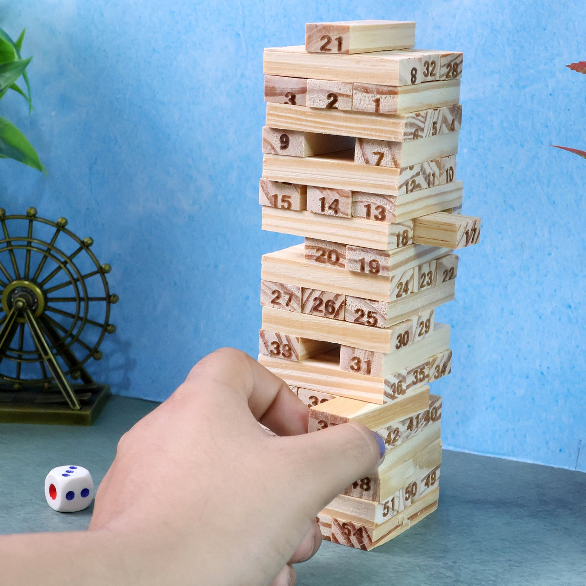 Wooden Tumbling Tower Game in progress showing stacked numbered blocks Main image