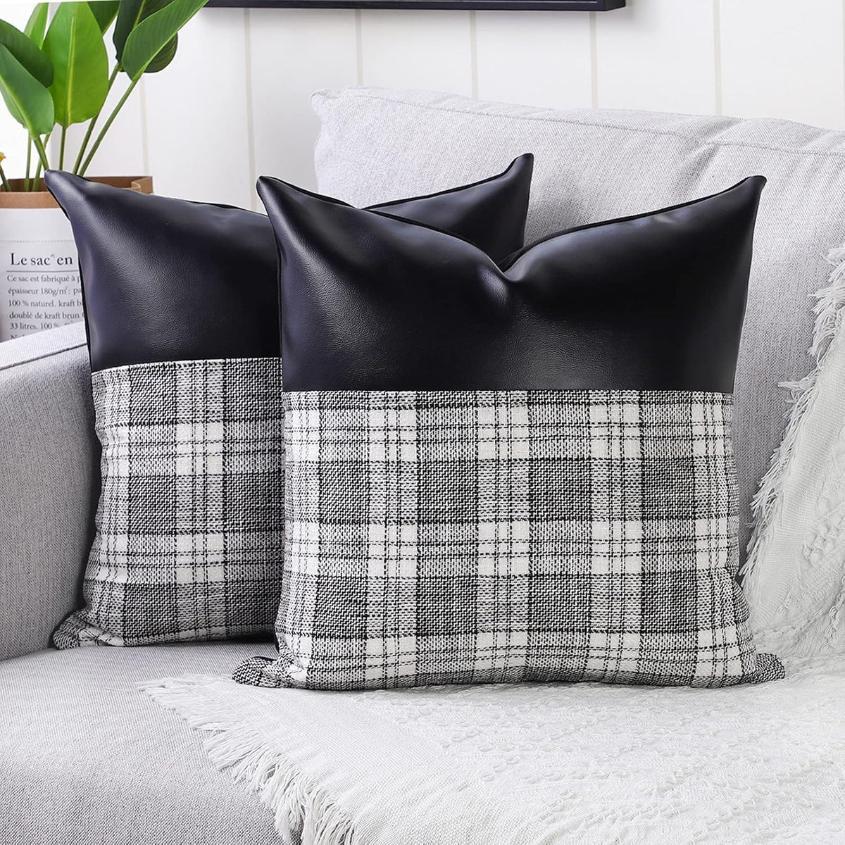 Close-up of a pair of Styleva Leather & Cotton Pillow Covers with elegant texture. Main image