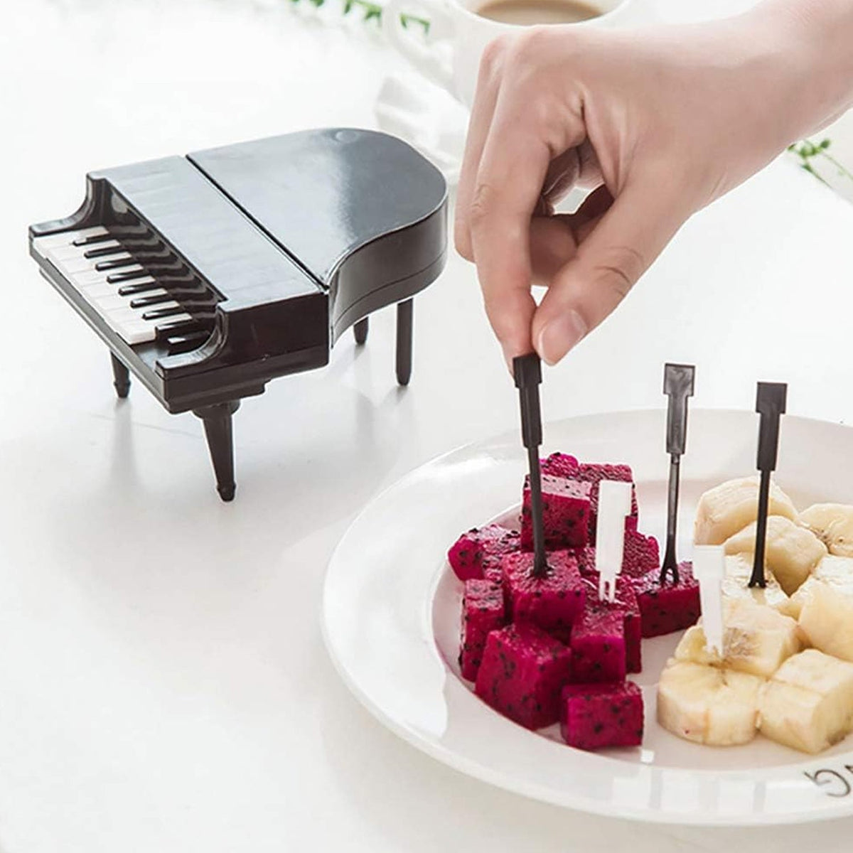 A set of creative piano fruit forks displayed elegantly, ready for delightful snacking. Main image