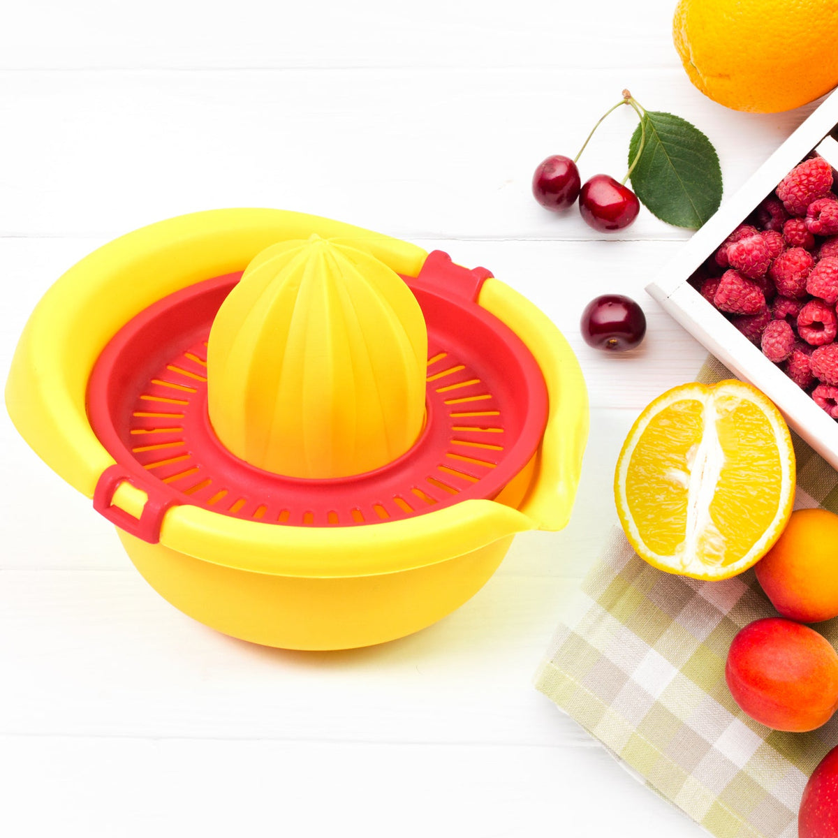 Orange Hand Press Juicer with a fresh cut orange, ready for squeezing. Main image