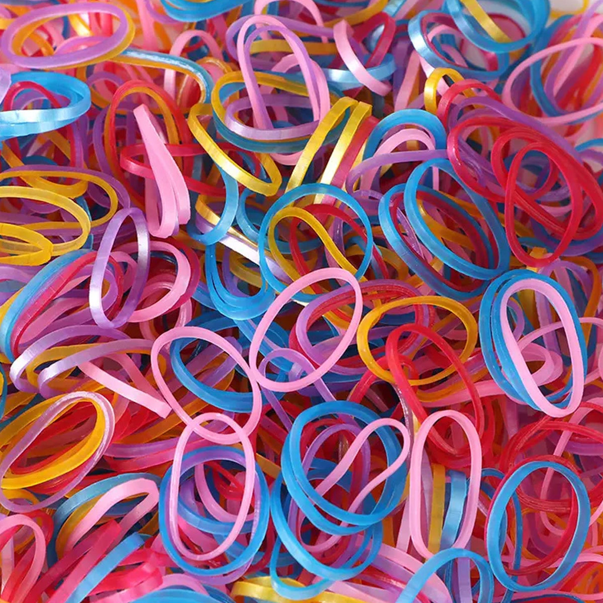 Multicolor elastic rubber bands neatly organized for office and home use. Main image