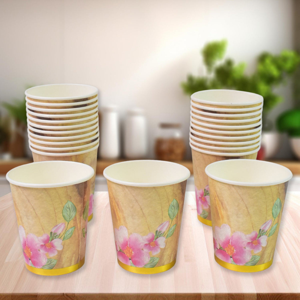 A stack of mixed design disposable paper cups ready for use at an Indian gathering. Main image
