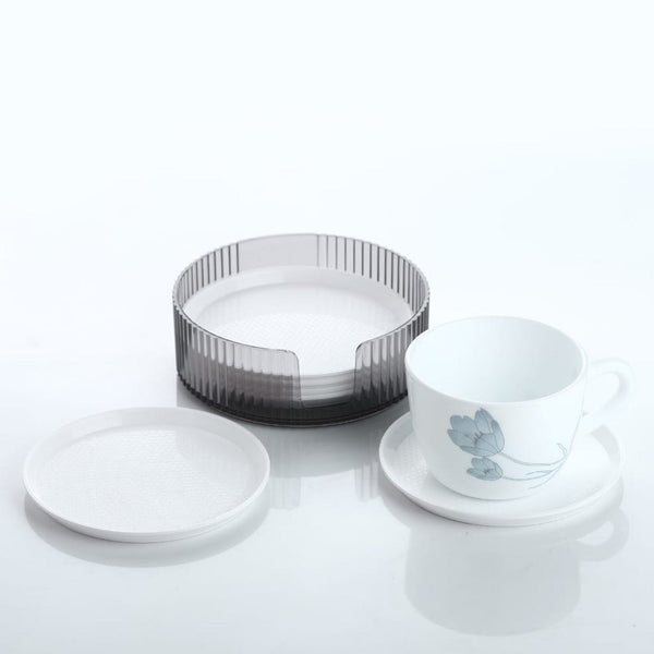 Durable plastic coasters effectively protecting a wooden surface from drink stains.