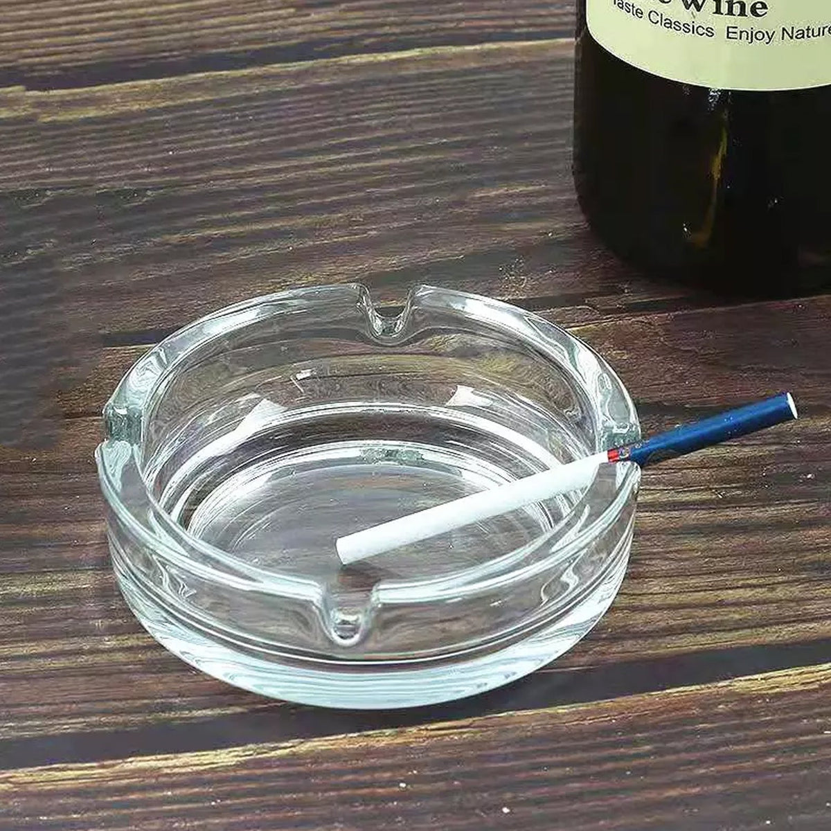 Elegant round crystal glass ashtray, perfect for modern home decor. Main image