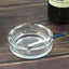Elegant round crystal glass ashtray, perfect for modern home decor.