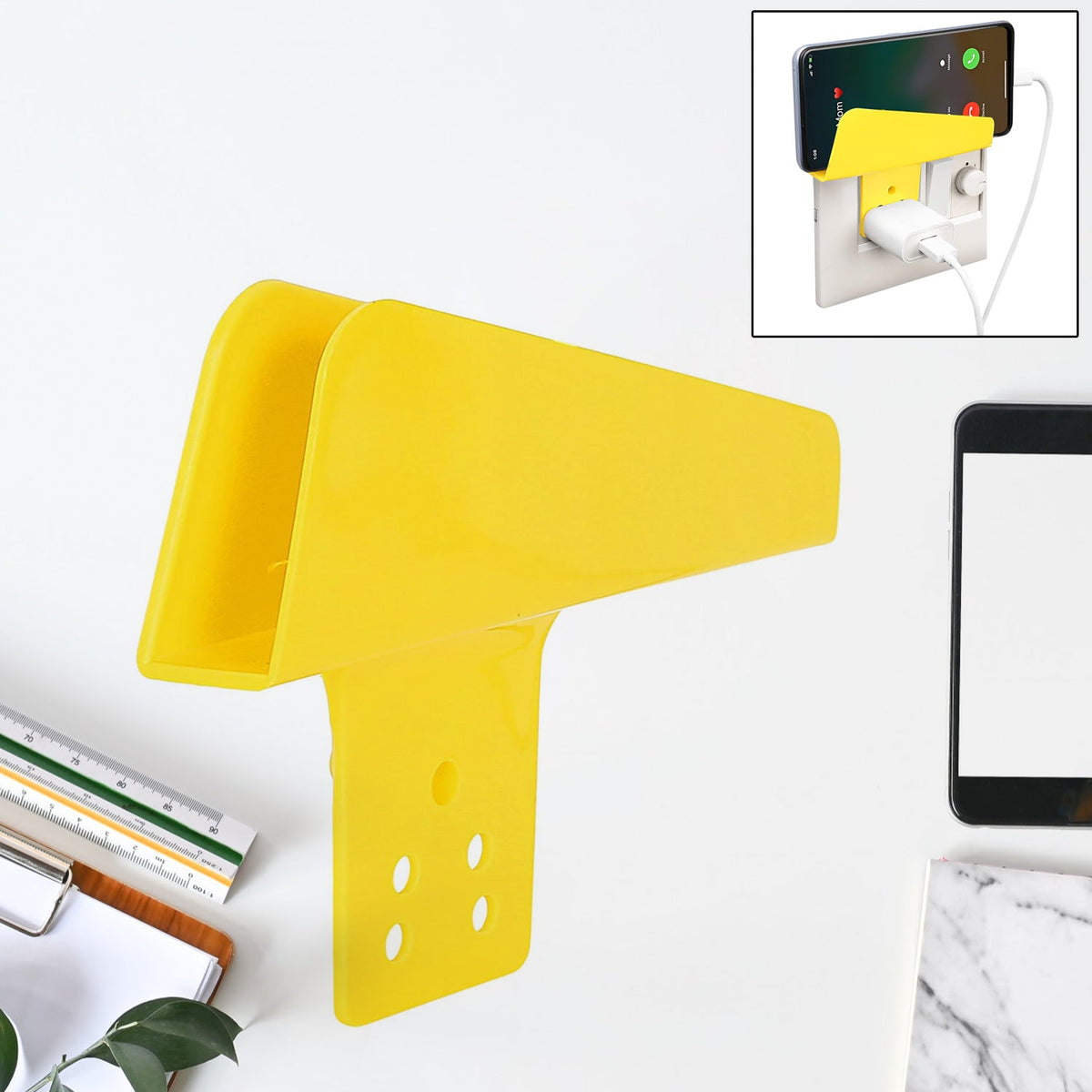 Gambit Mobile Charging Stand securely holding a smartphone while plugged into a wall socket. Main image