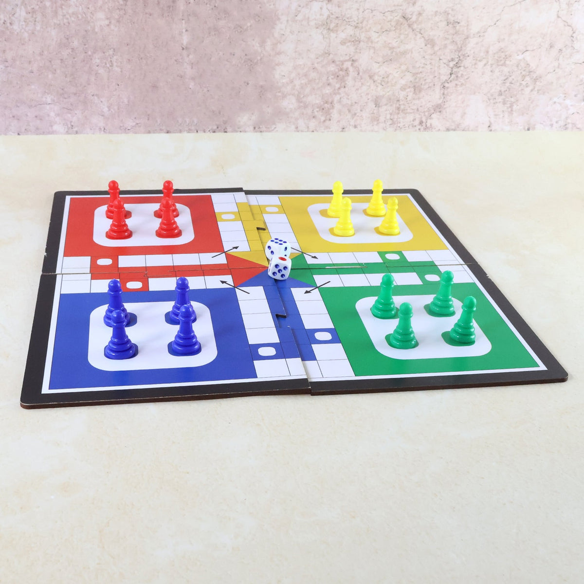 Pocket Ludo game board set up for play with colourful pawns and dice. Main image