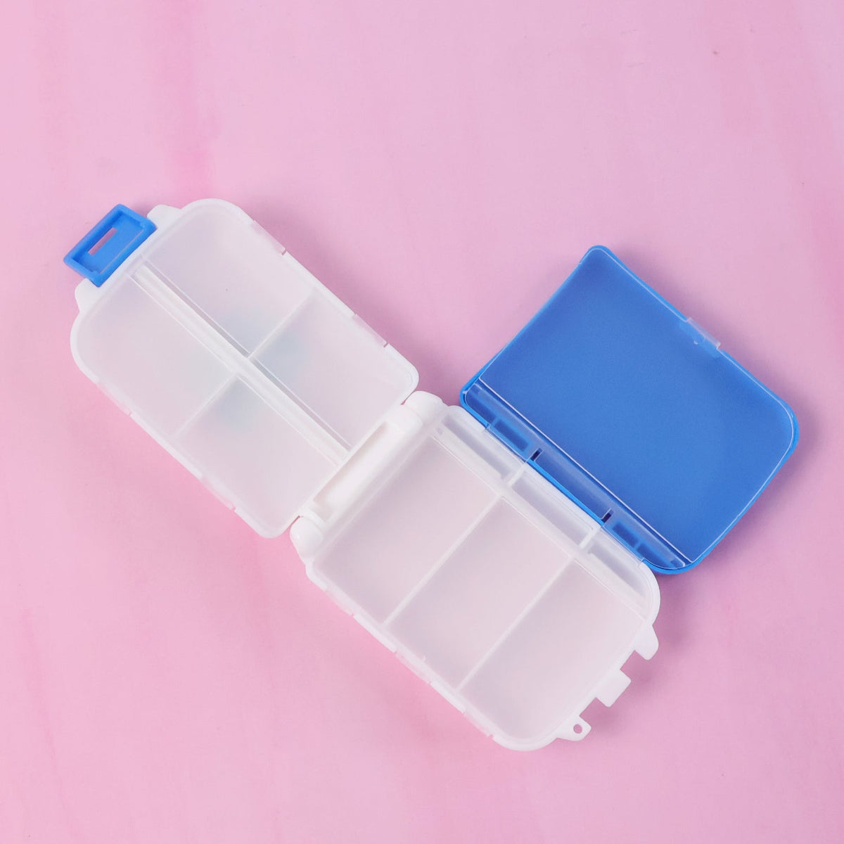 Blue dual-sided pill organizer box showing compartments Main image
