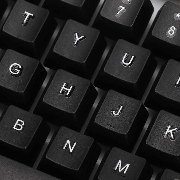 Angled view of the wired keyboard, highlighting its full-size layout and ergonomic key placement.
