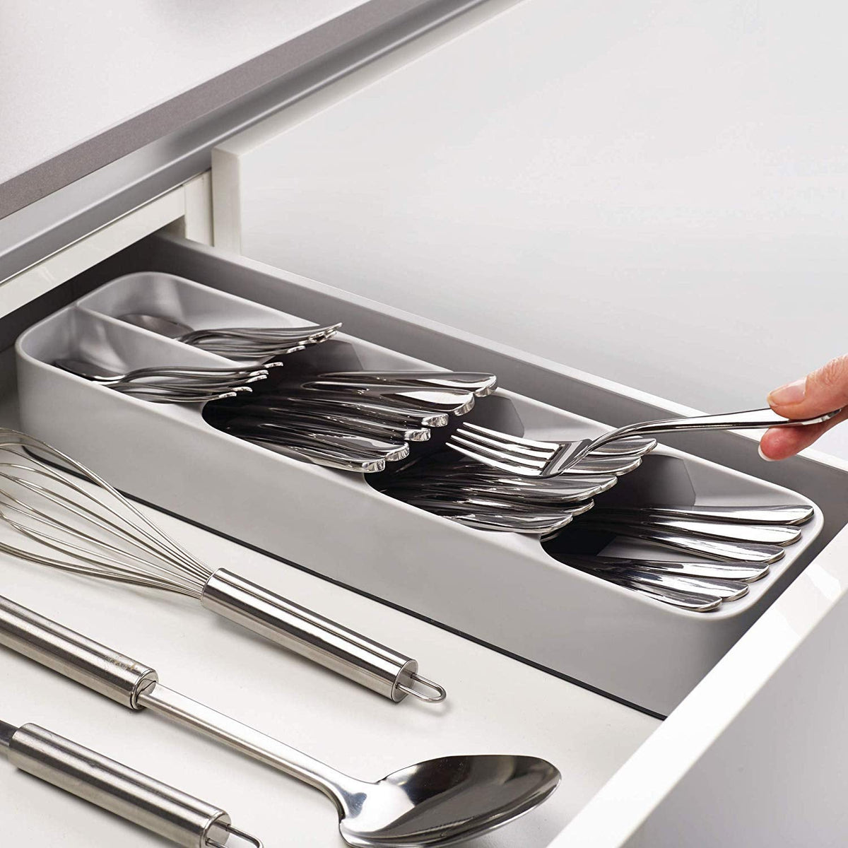 An empty, grey plastic cutlery tray with multiple compartments for kitchen drawer organisation. Main image