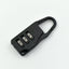 A sleek black 3-digit luggage lock securely attached to a suitcase zipper.