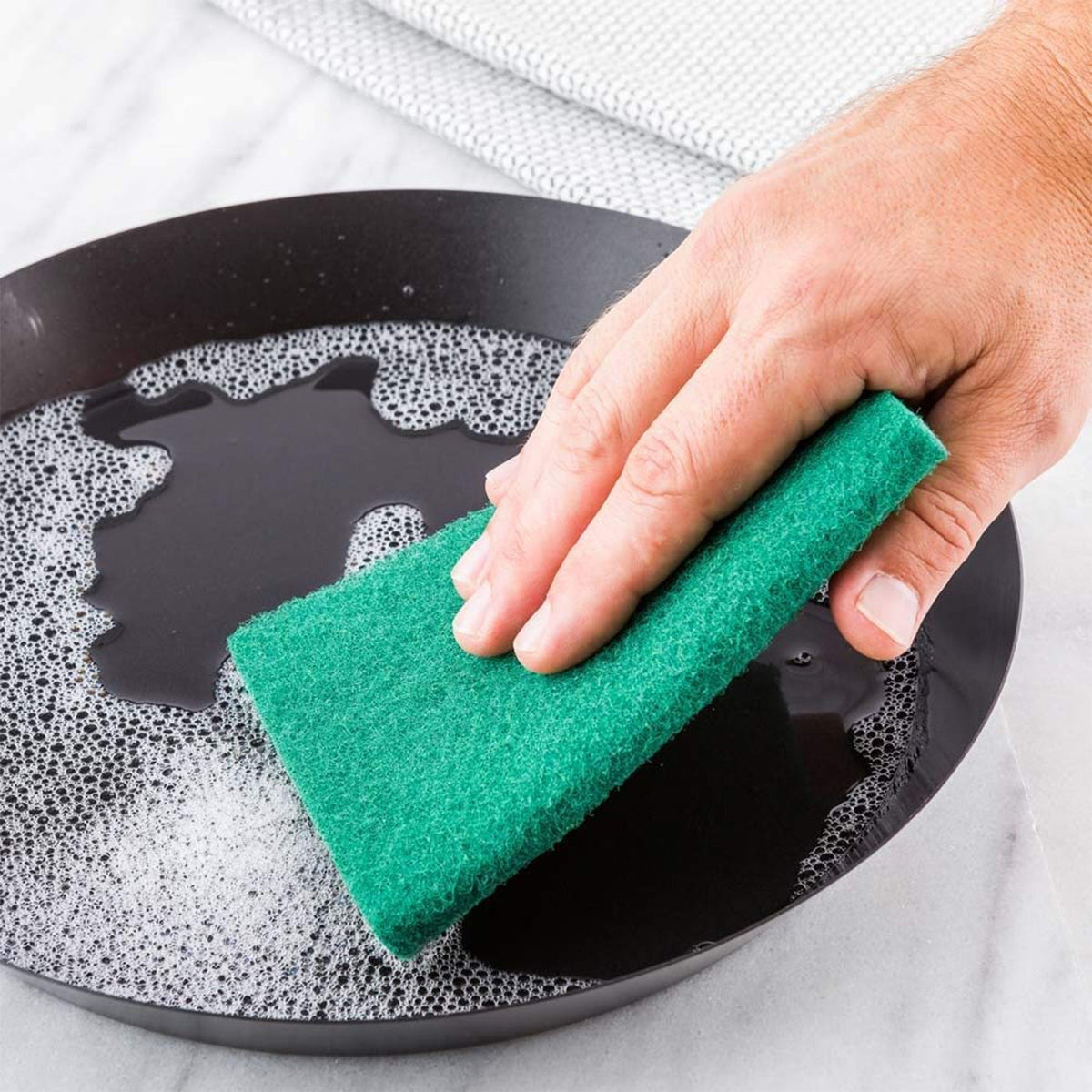 Pack of 10 aqua green scrub sponge pads with advanced stain cutter technology. Main image